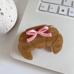 Creative croissant-shaped acetate hair claw clip with a cute pink bow decoration