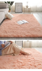 Detailed view of plush shaggy rug in dusty rose color for cozy living room decor