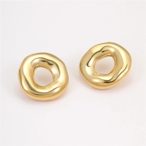 Detailed view of hollow irregular circular stud earrings in 18k gold-plated steel