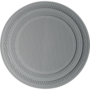 Extra-large round gray silicone honeycomb placemats in a nested set of various sizes