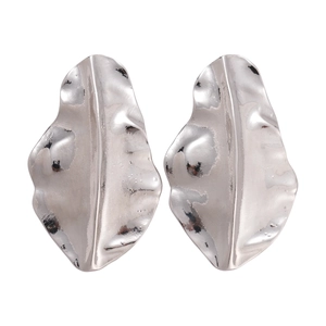 Silver textured irregular leaf earrings with metallic finish in a minimalist style