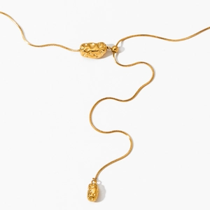 Elegant gold oval pendant necklace with hammered texture on a sleek snake chain for women