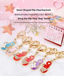 Detail of colorful rhinestone-studded flip-flop keychains with sparkling enamel charms