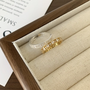 Set of two adjustable 925 sterling silver rings with paved zircon stones in gold and silver