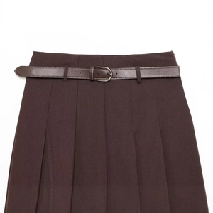 Women's brown pleated midi skirt with matching leather belt and high waist detail