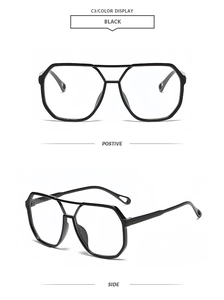 Detail view of black geometric oversized sunglasses with double bridge and modern frame