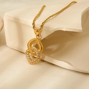 Golden double ring pendant necklace with zircon crystals and twisted rope chain