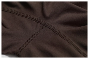 Macro detail of the high-stretch yoga bodysuit showing reinforced flatlock stitching
