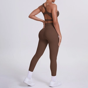 Detail of dark brown yoga set featuring open back sports bra and high-waisted leggings
