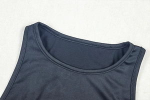 Close-up of the round neckline and stitching on a black sleeveless ruched dress