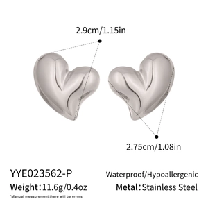 Detailed view of silver puffy heart earrings with dimensions and material specs