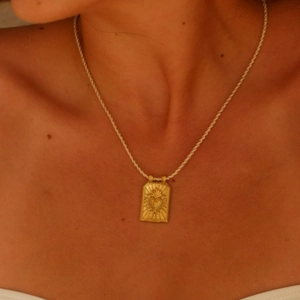 Sacred Heart pendant necklace in gold finish featuring a detailed rectangular tarot charm