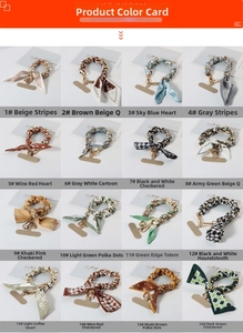 Detailed grid display of 16 printed silk scarf phone wrist straps with gold chain accents