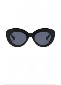 Close-up of vintage cat-eye sunglasses featuring UV filter lenses and sleek black frames