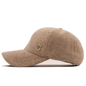 Beige corduroy baseball cap with a gold-tone rhinestone-encrusted G logo on side