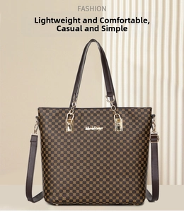 Detail of dark brown tote bag featuring golden hardware and repeated geometric pattern