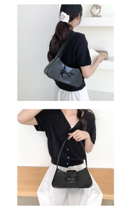 Detailansicht einer schwarzen PU-Lederhandtasche mit stilvoller dekorativer Schleife