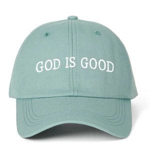 Detail shot of white God Is Good embroidery on a mint green cotton baseball cap