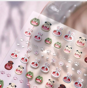 Close-up of 3D cute animal nail stickers featuring rabbits and frogs with relief texture