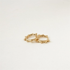Detailed view of 925 sterling silver hoop earrings with gold plating and 925 hallmark
