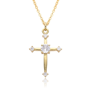 Macro shot of gold cross pendant with five inlaid zircon stones and polished O-chain link