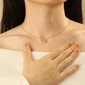 Gold letter B pendant necklace with micro-paved rhinestones on a delicate chain