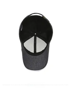 Internal view of a grey casual cap showing sweatband, stitching, and metal buckle details