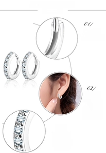 Close-up of S925 silver huggie earrings featuring micro-pave cubic zirconia stones