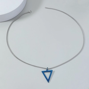 Macro shot of a blue hollow triangle pendant on a silver stainless steel chain necklace