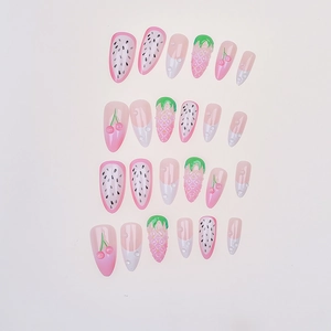Detail of 3D strawberry and fruit press-on nails with pearls and almond shape
