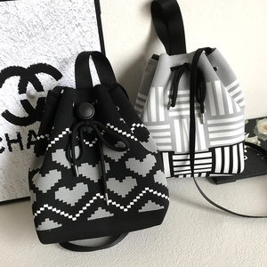 Knitted crossbody bucket bags with houndstooth and heart patterns and drawstring closures