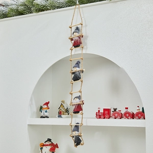 Detail view of 4 Christmas gnomes on a rustic wooden rope ladder decoration