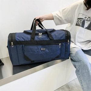 Deep blue nylon travel bag with heavy-duty handles and front zipper compartments