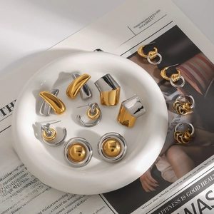 Polished two-tone gold and silver stainless steel earring set with geometric designs