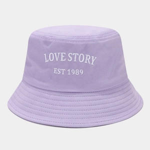 Detail of lavender cotton bucket hat with white Love Story letter embroidery