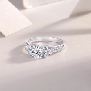 Macro view of S925 sterling silver ring with large round solitaire diamond and side stones