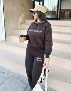 Close-up of vintage brown polo sweatshirt and joggers with white Tribeca embroidery