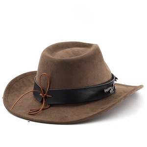Detail of suede cowboy hat with leather band and metallic silver ornaments