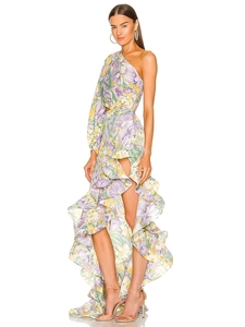 Detail of ruffled asymmetric hem and high slit on a floral off-shoulder dress