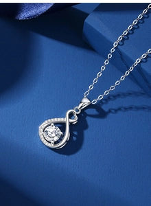 Macro shot of silver S925 heart pendant necklace with shimmering moissanite zircon details