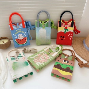 Various colorful knitted crossbody phone bags with cute cartoon patterns on white background