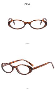 Macro view of vintage tortoiseshell oval glasses frames showing front and side profile