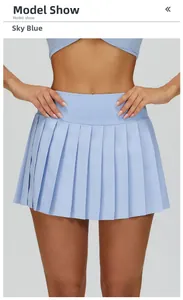 Detail of azure blue pleated tennis skirt with high waistband for athletic performance