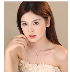 S925 sterling silver ginkgo leaf necklace with tassel and zircon on female model
