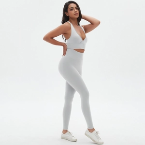 Side view of seamless cross back sports bra and high waist leggings yoga set
