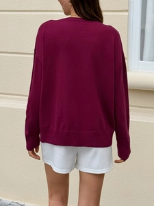 Rear view of wine red knit sweater with drop shoulder and ribbed cuffs for autumn