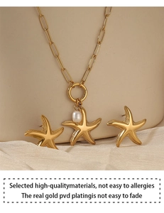 Detailed shot of gold starfish jewelry set with pearl necklace and allergy-free plating