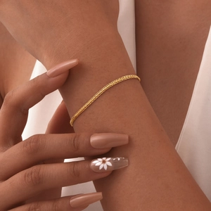 Detailed close-up of an 18K gold-plated braided stainless steel chain necklace for women