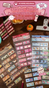 Detail of cute retro food stickers featuring sushi and dessert motifs for journaling