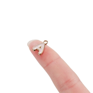 Mini gold alloy A-letter charm with white enamel on fingertip for DIY jewelry size reference